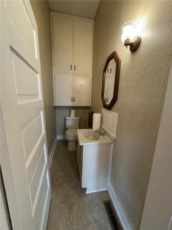 bathroom with vanity and toilet