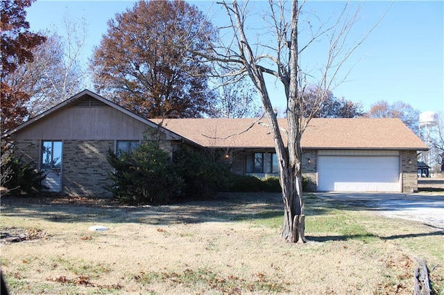 ranch-style house with a garage and a front yard