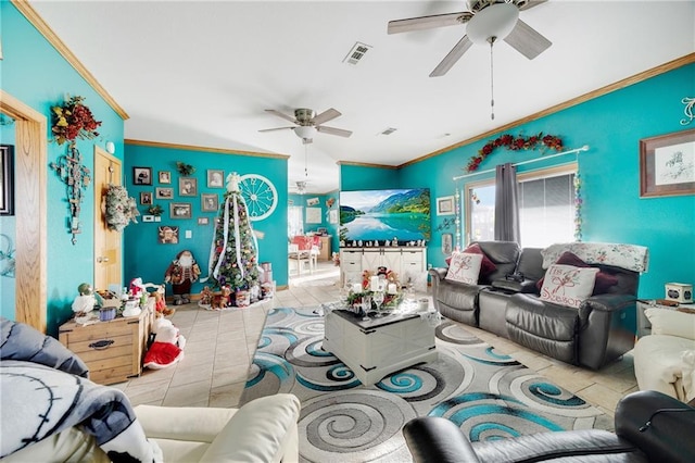 tiled living room with ceiling fan and crown molding