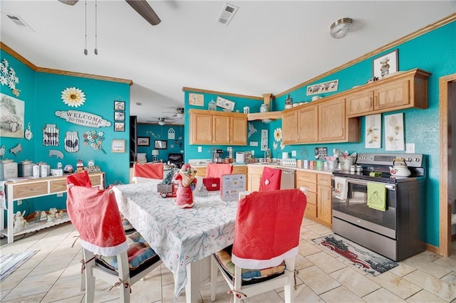 kitchen featuring appliances with stainless steel finishes, light brown cabinetry, ceiling fan, crown molding, and sink