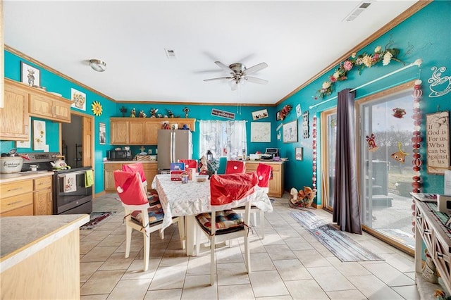 dining room featuring ceiling fan, light tile patterned floors, and ornamental molding