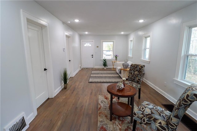 entrance foyer with dark hardwood / wood-style floors