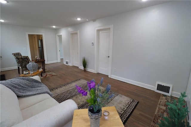 living room featuring dark hardwood / wood-style floors