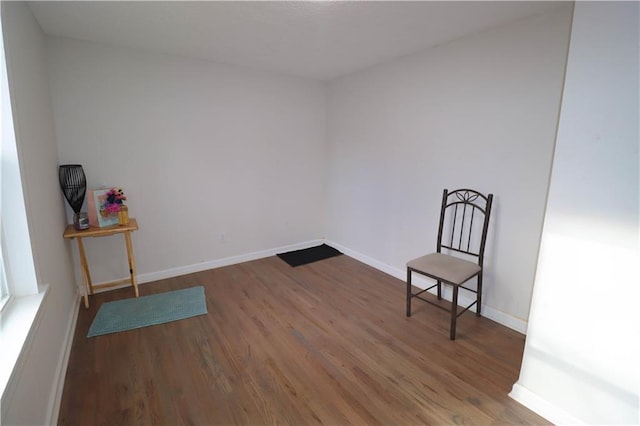 unfurnished room with hardwood / wood-style floors