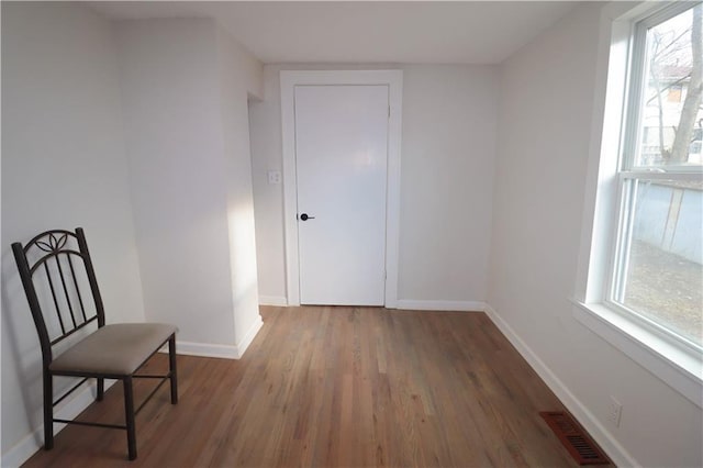 unfurnished room featuring wood-type flooring