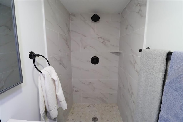 bathroom with tiled shower