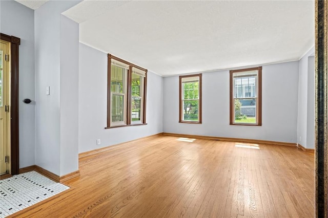 empty room with light hardwood / wood-style floors