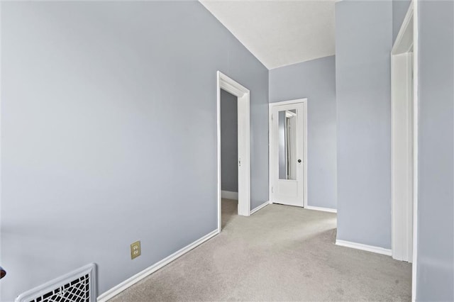 unfurnished room with light carpet