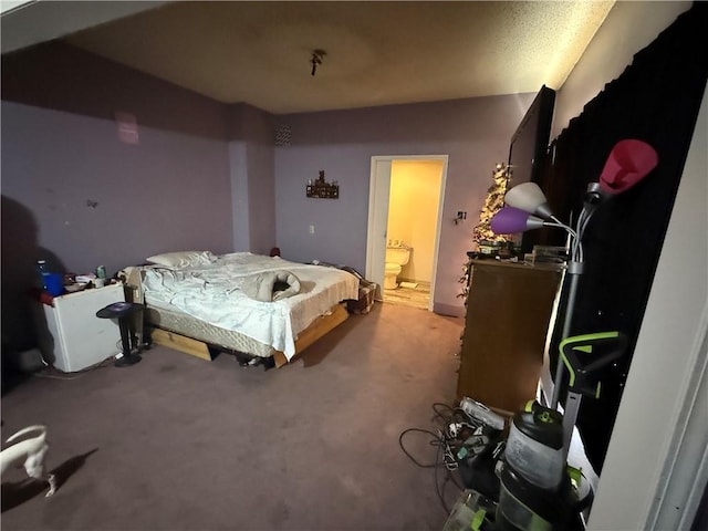 carpeted bedroom featuring ensuite bathroom