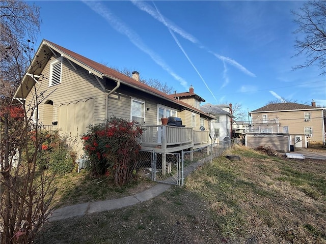 view of home's exterior featuring a deck