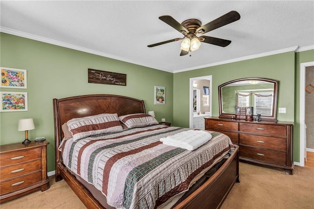 bedroom featuring ensuite bathroom, crown molding, ceiling fan, and light carpet