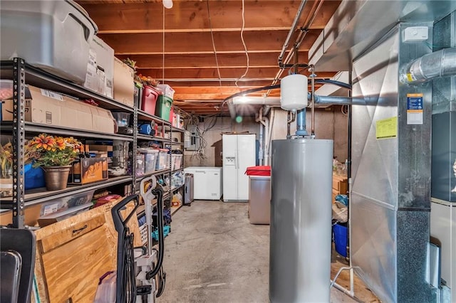 interior space with heating unit, white refrigerator with ice dispenser, and water heater