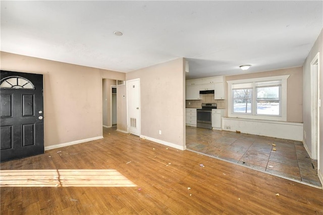 unfurnished living room with hardwood / wood-style floors