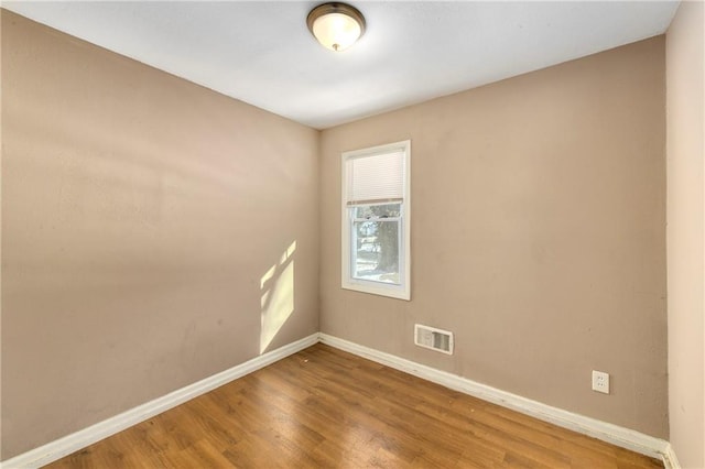 empty room featuring hardwood / wood-style flooring