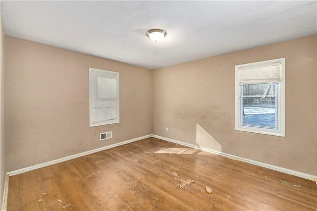 empty room featuring wood-type flooring