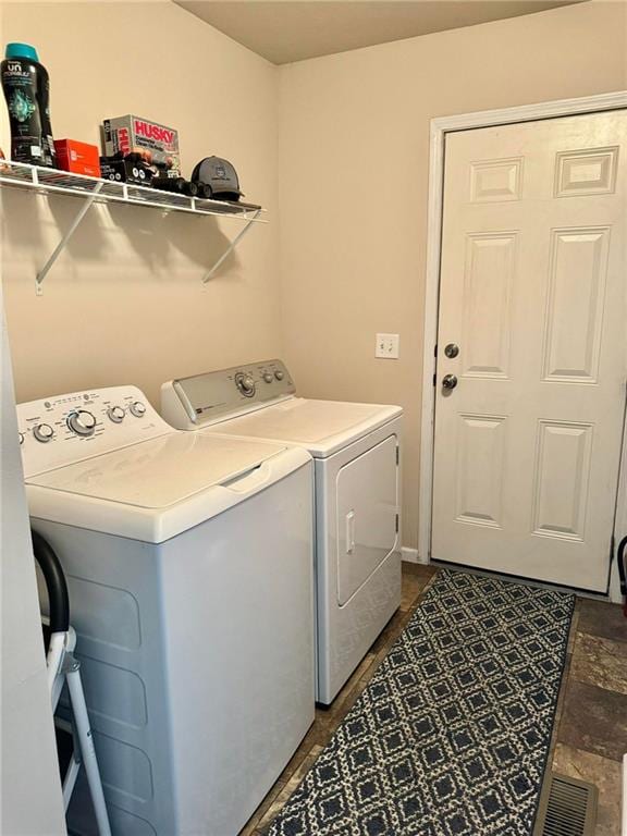 washroom with washing machine and dryer