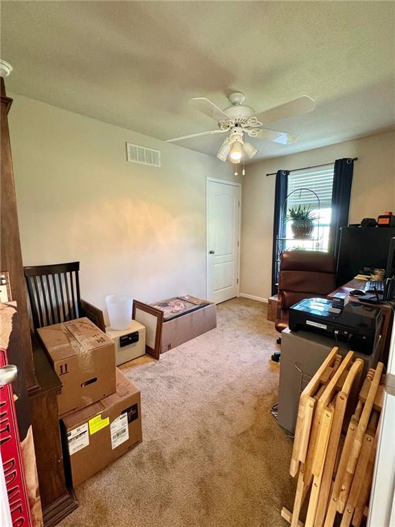 carpeted bedroom with ceiling fan