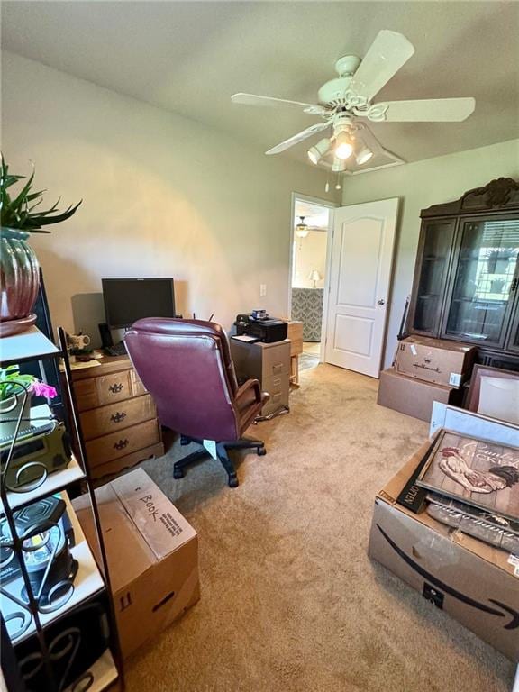 carpeted office space with ceiling fan