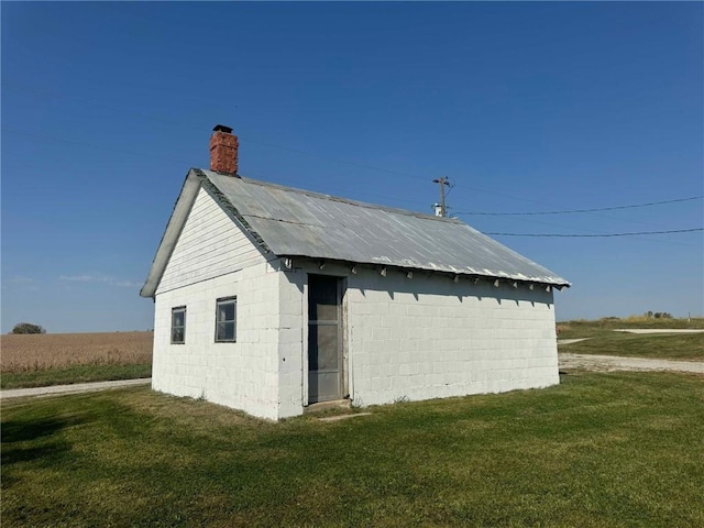 exterior space with a yard and an outdoor structure