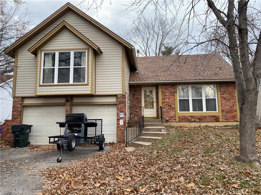 split level home with a garage