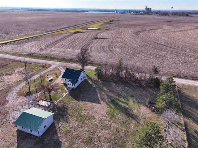 birds eye view of property featuring a rural view