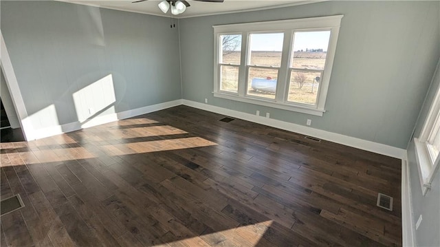 unfurnished room with dark hardwood / wood-style floors and ceiling fan