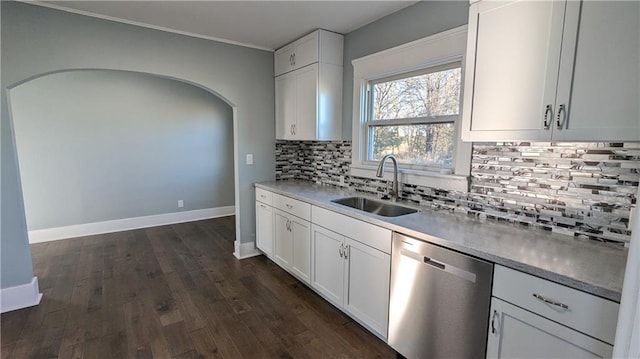 kitchen with white cabinetry, stainless steel dishwasher, dark wood-type flooring, and sink