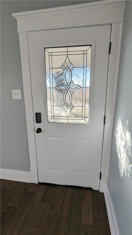 doorway to outside featuring dark hardwood / wood-style flooring