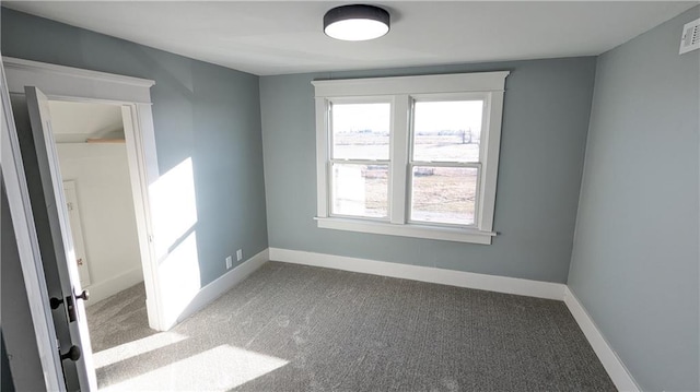 spare room with light colored carpet