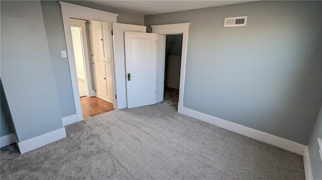 unfurnished bedroom with carpet