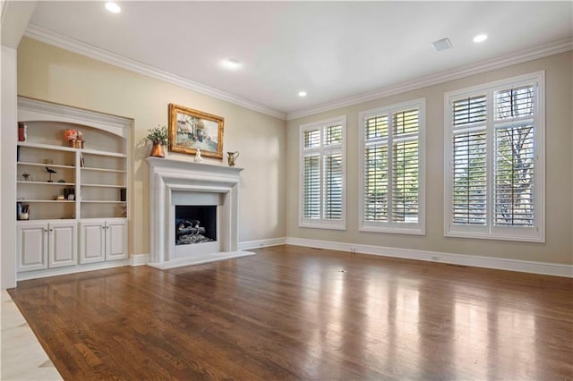 unfurnished living room with crown molding, built in features, and hardwood / wood-style flooring