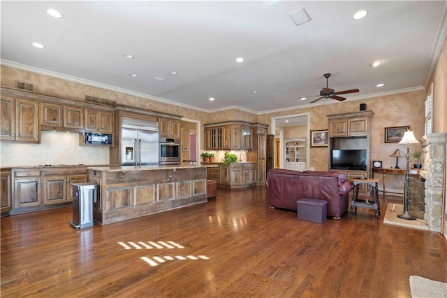 living room with crown molding, ceiling fan, and dark hardwood / wood-style floors