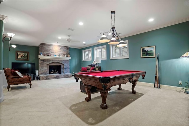 recreation room with ornamental molding, light carpet, a fireplace, and billiards