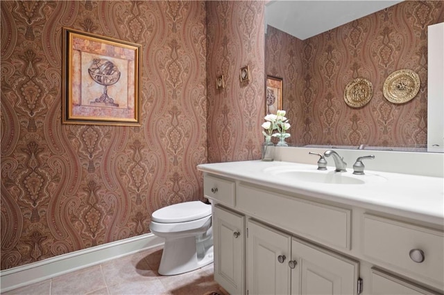 bathroom featuring vanity, tile patterned floors, and toilet