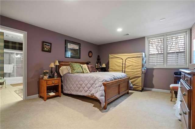 carpeted bedroom with ensuite bathroom