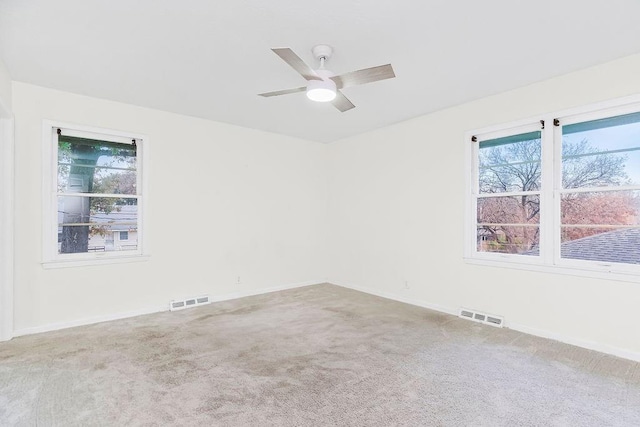 carpeted empty room with ceiling fan