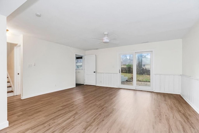 unfurnished room featuring light wood-type flooring and ceiling fan