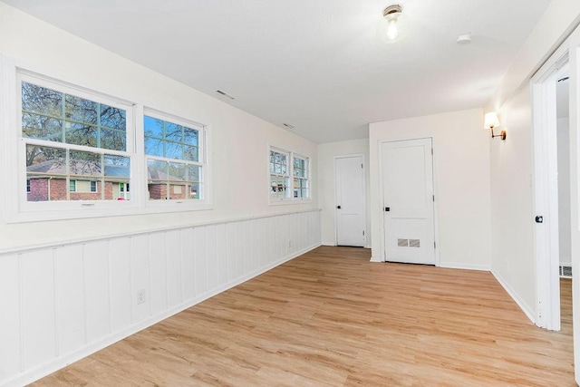 unfurnished room featuring light hardwood / wood-style floors