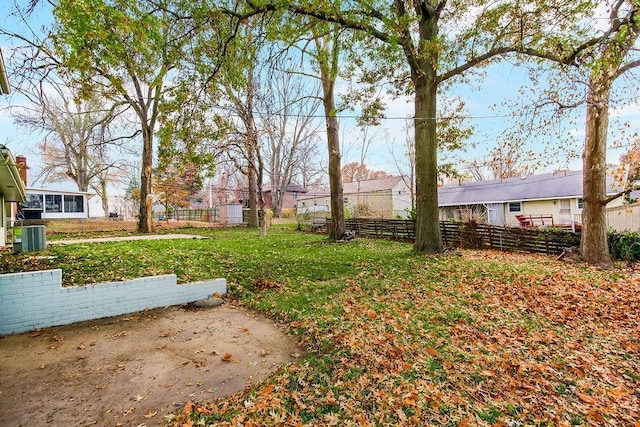 view of yard with central AC unit