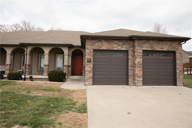 view of front of home featuring a porch, a garage, and a front lawn