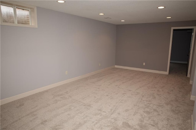 unfurnished room featuring carpet