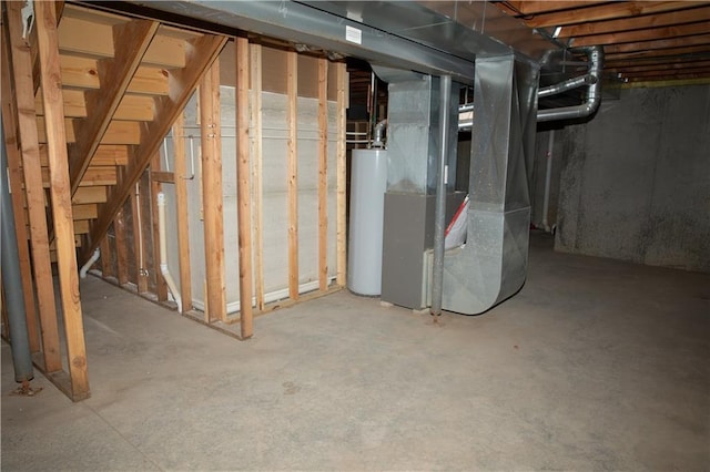 basement featuring heating unit and water heater