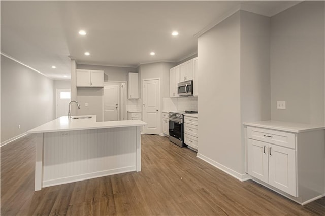 kitchen with sink, white cabinets, stainless steel appliances, and dark hardwood / wood-style floors