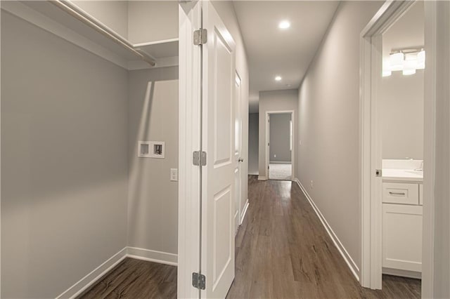 hallway with dark wood-type flooring