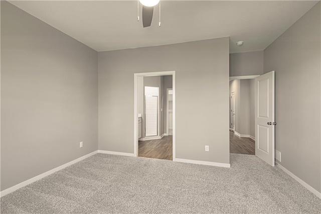 unfurnished bedroom with dark colored carpet