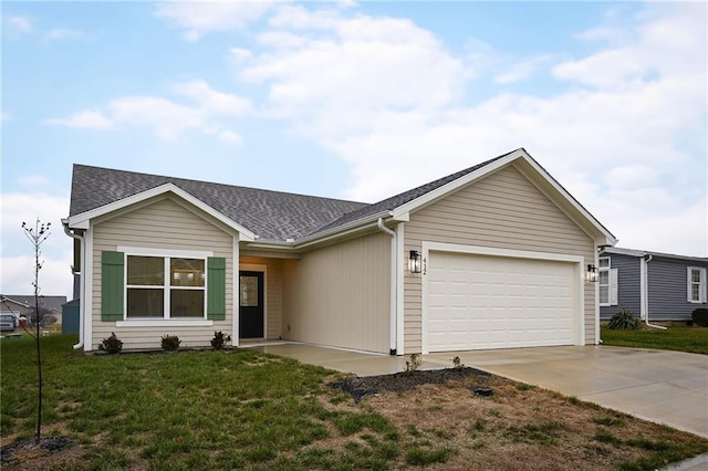 ranch-style home with a garage and a front lawn