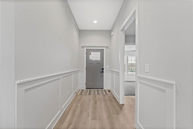 doorway with light hardwood / wood-style flooring