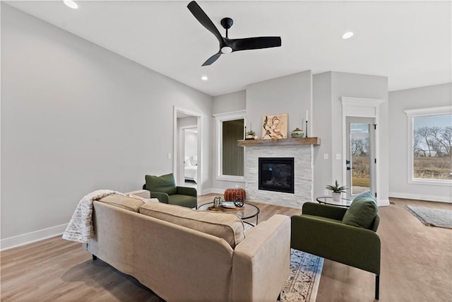 living room with hardwood / wood-style floors and ceiling fan