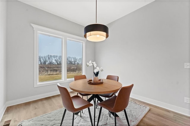 dining space featuring light hardwood / wood-style floors