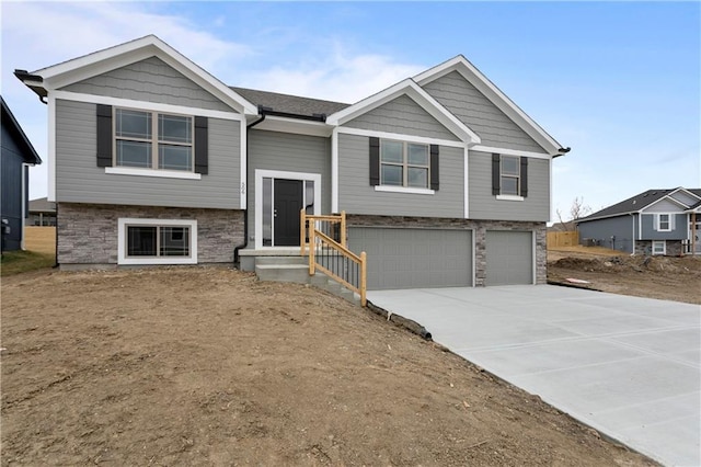 bi-level home featuring a garage